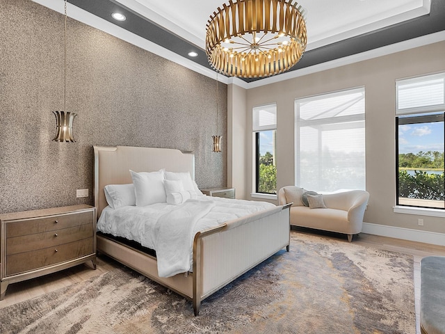 bedroom featuring recessed lighting, wood finished floors, ornamental molding, baseboards, and a notable chandelier