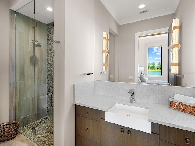 bathroom with vanity and a stall shower