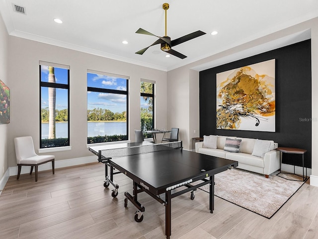 rec room featuring visible vents, ceiling fan, baseboards, and light wood-style floors