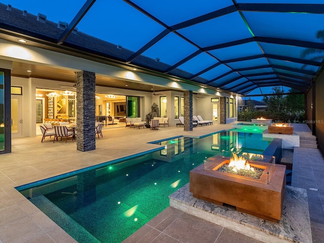 outdoor pool with an outdoor living space with a fire pit, a ceiling fan, a patio area, and a hot tub