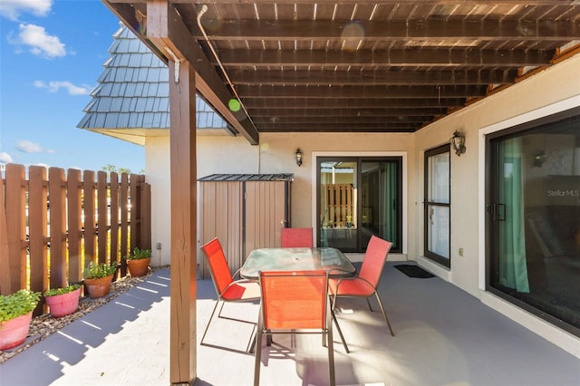 14519 Catalina Cir, Seminole, FL 33776 - view of patio / terrace with outdoor dining area and fence