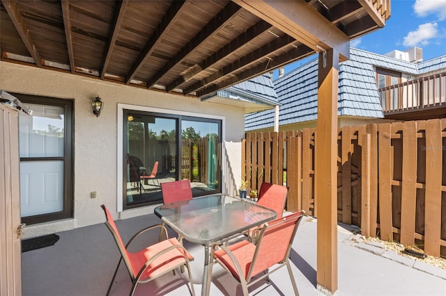 14519 Catalina Cir, Seminole, FL 33776 - view of patio / terrace featuring fence and outdoor dining space
