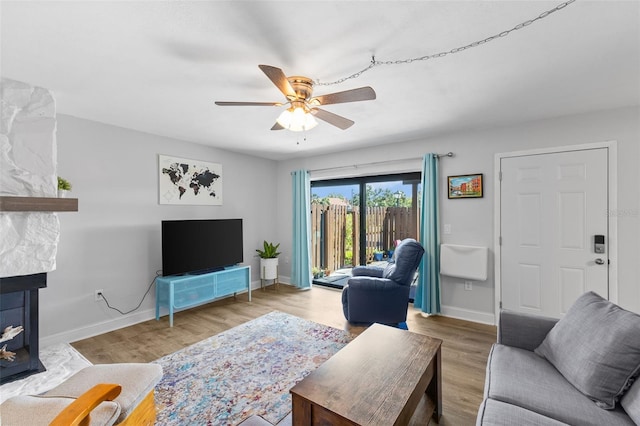 14519 Catalina Cir, Seminole, FL 33776 - living room featuring baseboards, wood finished floors, and ceiling fan