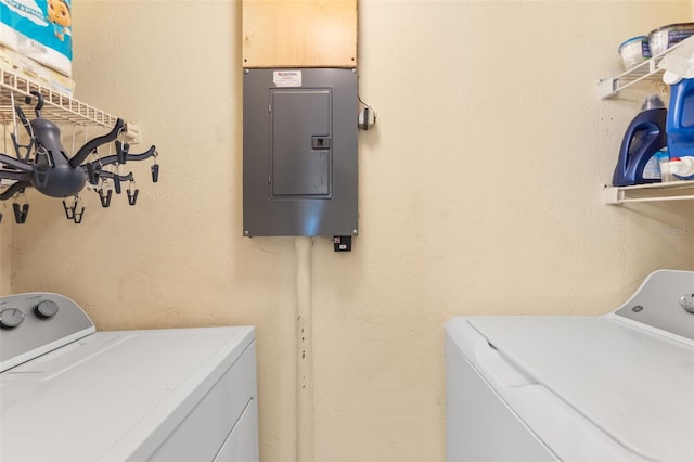 14519 Catalina Cir, Seminole, FL 33776 - washroom with washing machine and dryer, electric panel, and laundry area