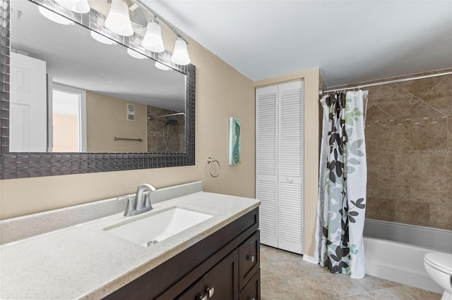 14519 Catalina Cir, Seminole, FL 33776 - full bathroom with a closet, vanity, shower / tub combo with curtain, toilet, and tile patterned flooring