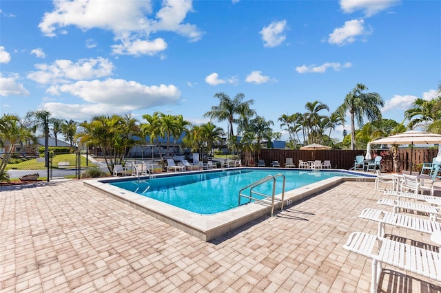 14519 Catalina Cir, Seminole, FL 33776 - community pool featuring fence and a patio