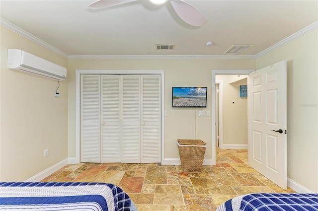 bedroom with crown molding, stone tile floors, visible vents, and an AC wall unit