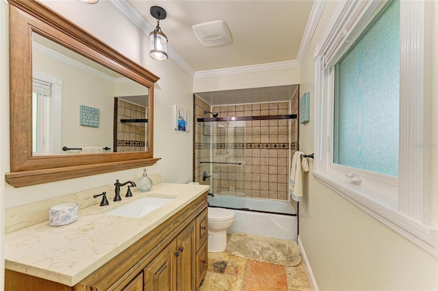 full bathroom with bath / shower combo with glass door, toilet, stone finish flooring, crown molding, and vanity