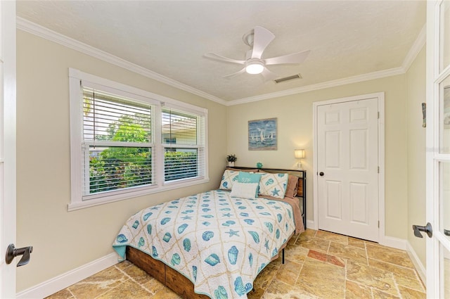bedroom with stone finish flooring, baseboards, ornamental molding, and visible vents