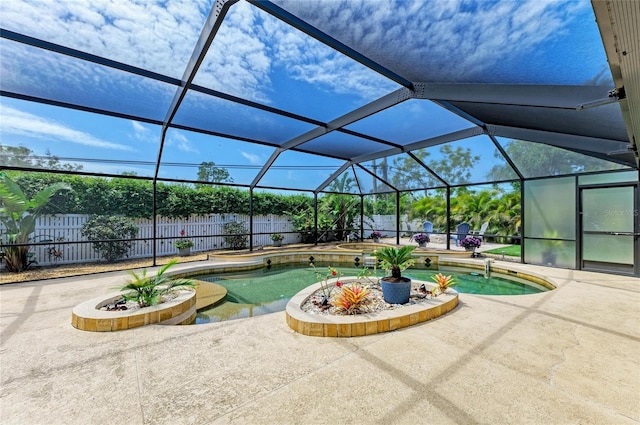 view of swimming pool featuring a fenced backyard, a patio, a fenced in pool, and glass enclosure
