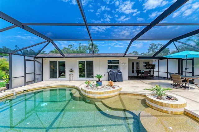 pool with glass enclosure, a patio, and outdoor dining area