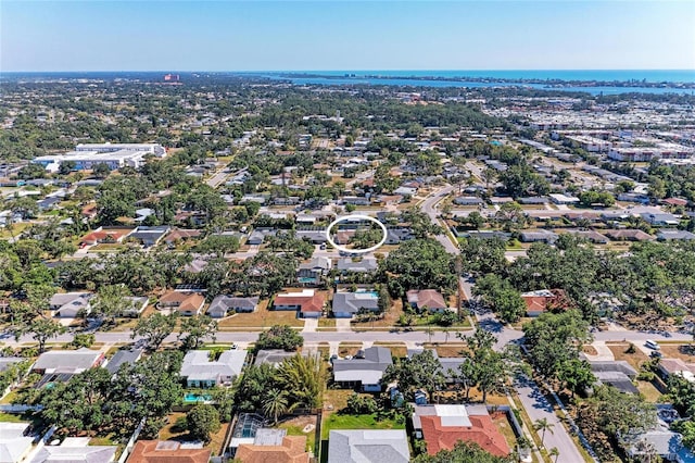 bird's eye view featuring a water view and a residential view