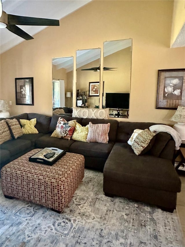 living area with lofted ceiling and ceiling fan