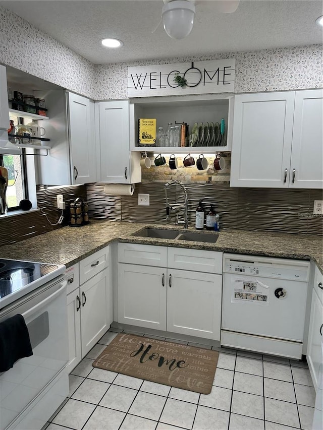kitchen featuring open shelves, white appliances, a sink, and white cabinets