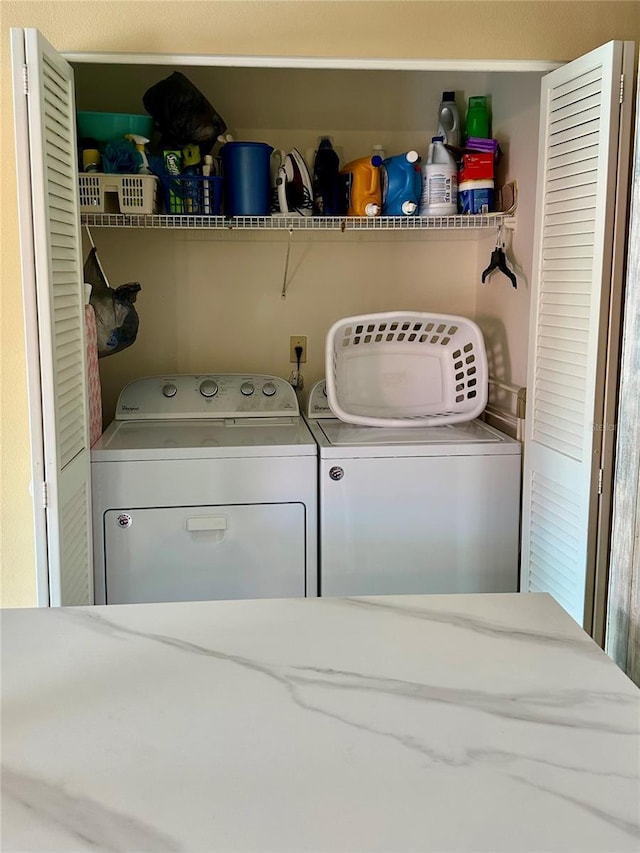 laundry area featuring washer and dryer and laundry area