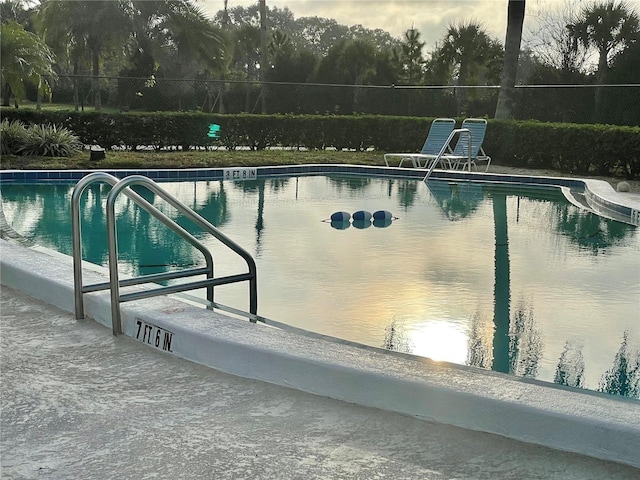 community pool featuring fence