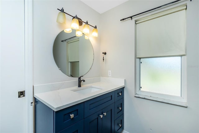 bathroom with baseboards and vanity