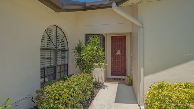 4691 Las Brisas Ln, Sarasota, FL 34238 - doorway to property featuring stucco siding