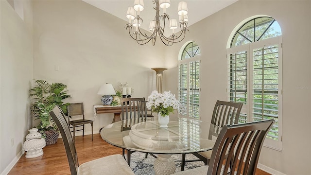 4691 Las Brisas Ln, Sarasota, FL 34238 - dining space with plenty of natural light, baseboards, and wood finished floors