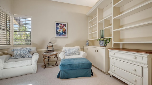 4691 Las Brisas Ln, Sarasota, FL 34238 - sitting room featuring baseboards and light carpet