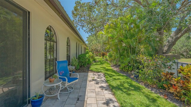 4691 Las Brisas Ln, Sarasota, FL 34238 - view of yard featuring a patio