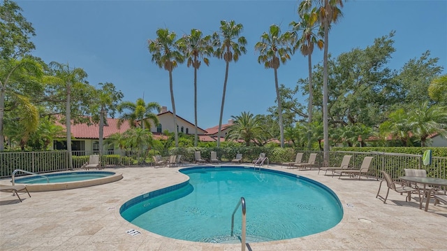 4691 Las Brisas Ln, Sarasota, FL 34238 - community pool featuring fence, a patio, and a community hot tub