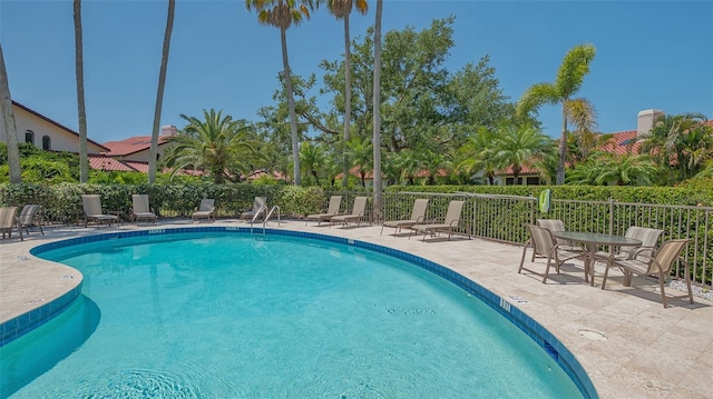 4691 Las Brisas Ln, Sarasota, FL 34238 - community pool with a patio and fence