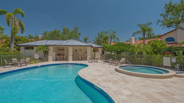 4691 Las Brisas Ln, Sarasota, FL 34238 - pool featuring fence, a patio, ceiling fan, and a hot tub