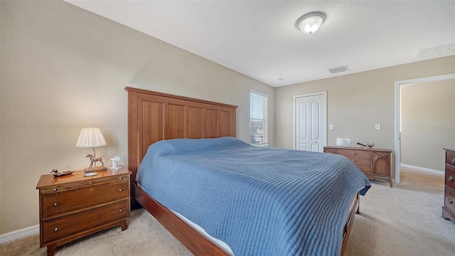 5403 Mang Pl, Sarasota, FL 34238 - bedroom with baseboards, visible vents, light carpet, and a closet