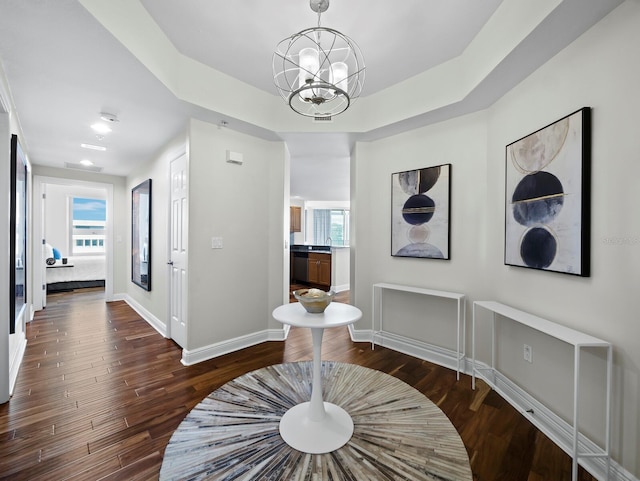 1771 Ringling Blvd Unit 1104, Sarasota, FL 34236 - hallway with an inviting chandelier, baseboards, wood finished floors, and a wealth of natural light