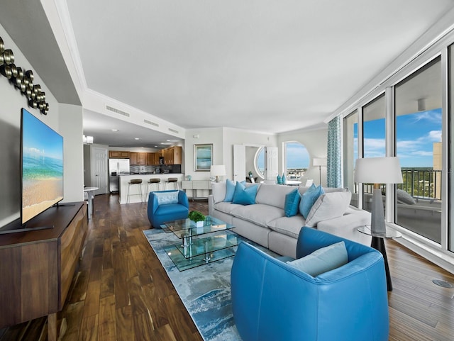 1771 Ringling Blvd Unit 1104, Sarasota, FL 34236 - living area with visible vents, crown molding, and dark wood-style floors