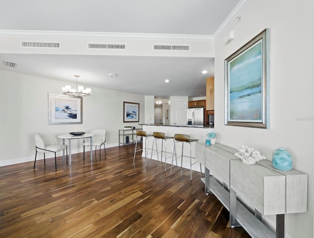 1771 Ringling Blvd Unit 1104, Sarasota, FL 34236 - interior space with stainless steel fridge, a breakfast bar area, a peninsula, and visible vents