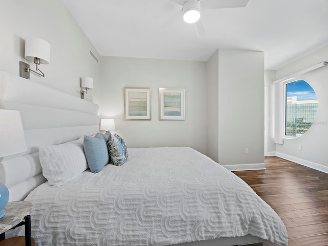 1771 Ringling Blvd Unit 1104, Sarasota, FL 34236 - bedroom featuring a ceiling fan, baseboards, visible vents, and wood finished floors