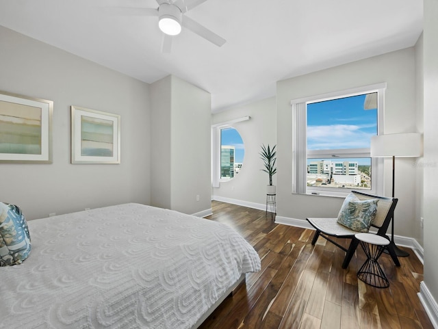 1771 Ringling Blvd Unit 1104, Sarasota, FL 34236 - bedroom featuring baseboards, ceiling fan, and dark wood-style flooring