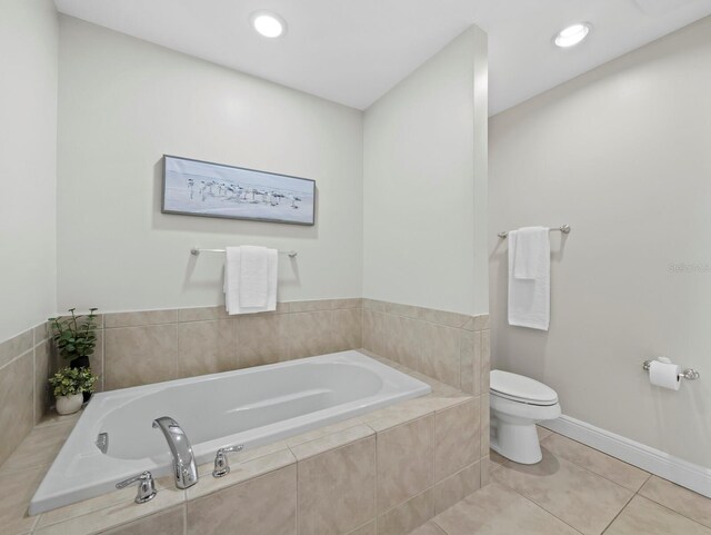 1771 Ringling Blvd Unit 1104, Sarasota, FL 34236 - full bath with a garden tub, tile patterned flooring, toilet, baseboards, and recessed lighting