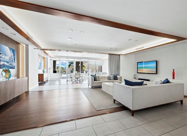 1771 Ringling Blvd Unit 1104, Sarasota, FL 34236 - living area featuring a raised ceiling and light tile patterned floors