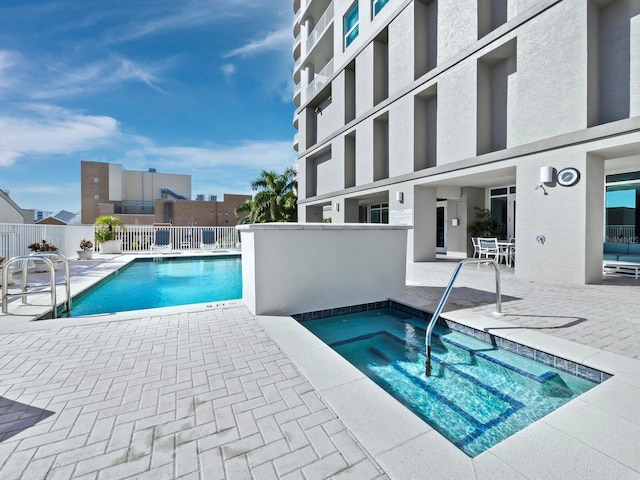 1771 Ringling Blvd Unit 1104, Sarasota, FL 34236 - community pool with a patio, a community hot tub, and fence