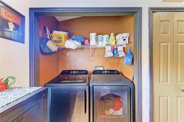 laundry area featuring washing machine and clothes dryer