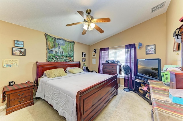 bedroom with light colored carpet, lofted ceiling, a ceiling fan, and baseboards