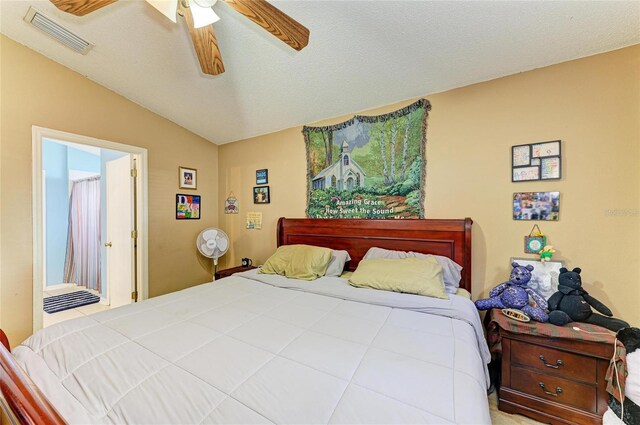 bedroom with vaulted ceiling and a ceiling fan