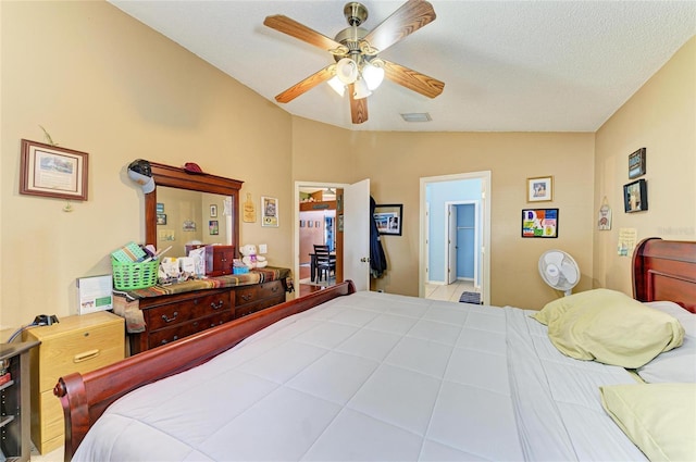 bedroom with lofted ceiling and a ceiling fan