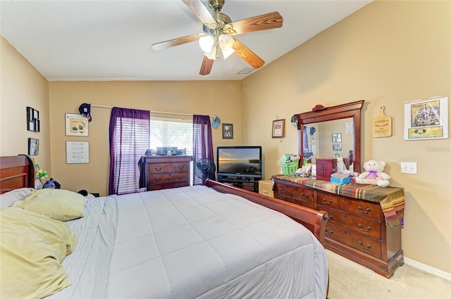 bedroom featuring lofted ceiling, light carpet, ceiling fan, and baseboards