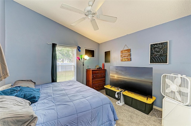 bedroom featuring carpet flooring, vaulted ceiling, and ceiling fan
