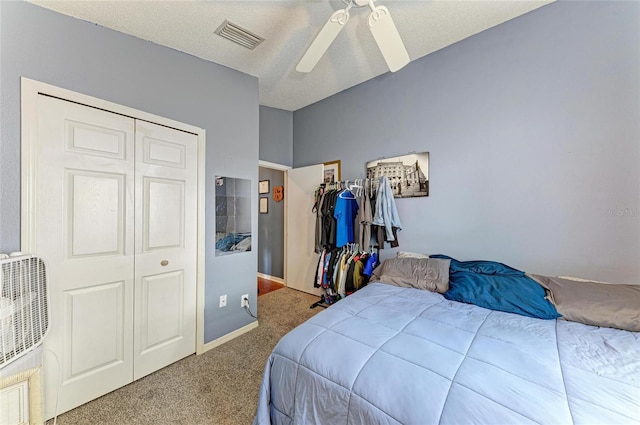 bedroom with carpet floors, a ceiling fan, a closet, and baseboards