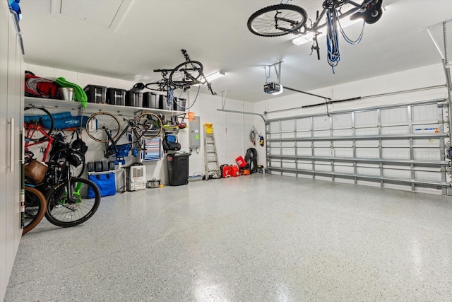 garage with electric panel and a garage door opener