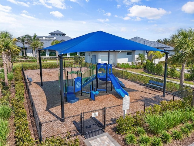 community play area with a gate and fence