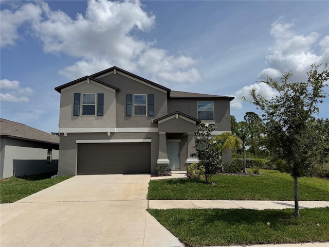 view of front of home with stucco siding, an attached garage, driveway, and a front lawn