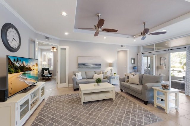 8045 Tybee Ct Unit 8045, University Park, FL 34201 - living room featuring light tile patterned floors, ornamental molding, a ceiling fan, and visible vents