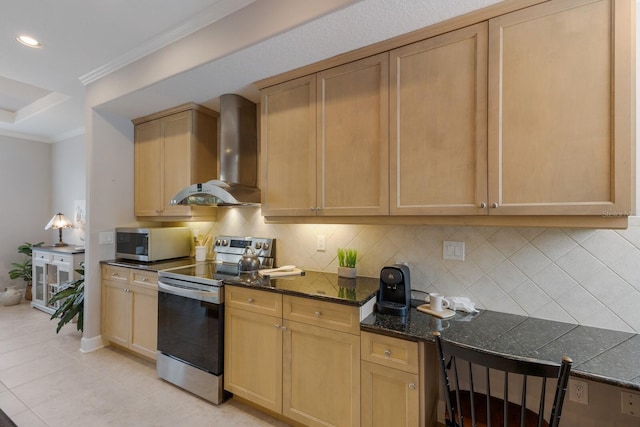 8045 Tybee Ct Unit 8045, University Park, FL 34201 - kitchen with light brown cabinets, wall chimney exhaust hood, stainless steel appliances, baseboards, and backsplash