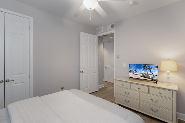8045 Tybee Ct Unit 8045, University Park, FL 34201 - bedroom with a ceiling fan, baseboards, visible vents, and wood finished floors